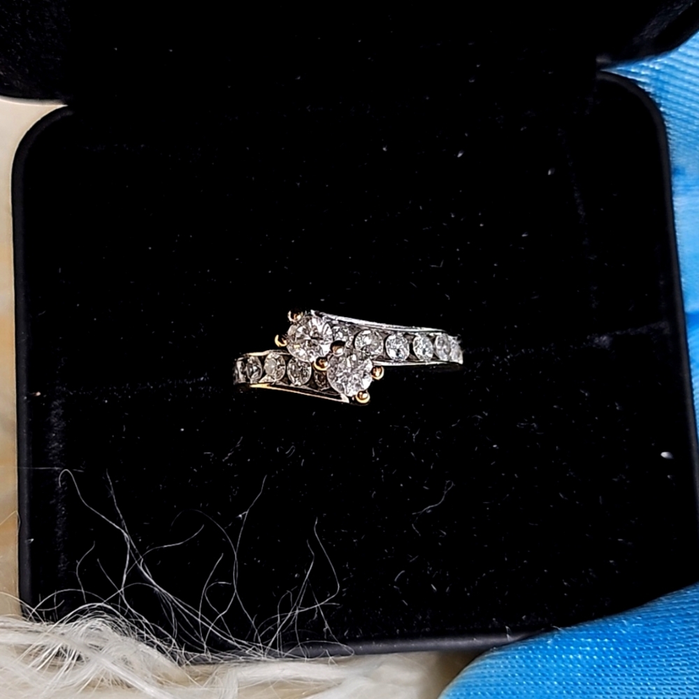 Ladies round brilliant natural diamond ring in 14 karat yellow and white gold.